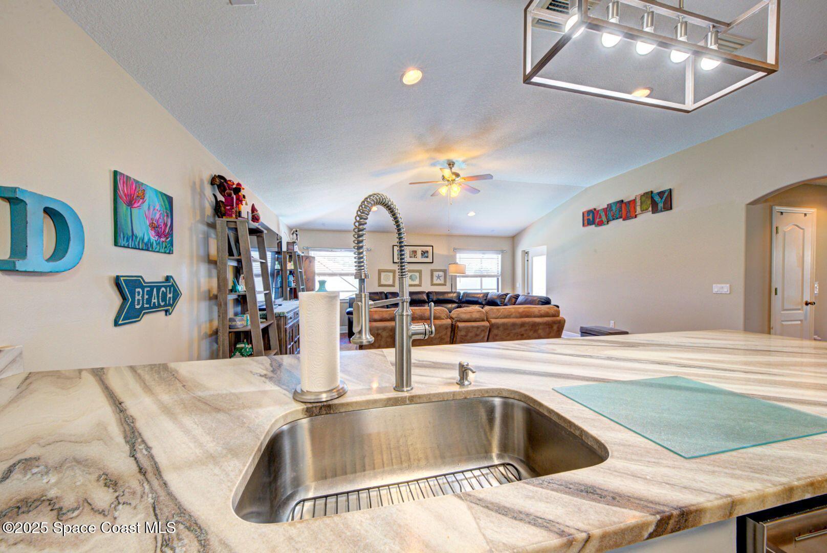 4082 Brantley Circle Rockledge, FL 32955 - Photo 7 of 31 Kitchen Overlooking Family Room