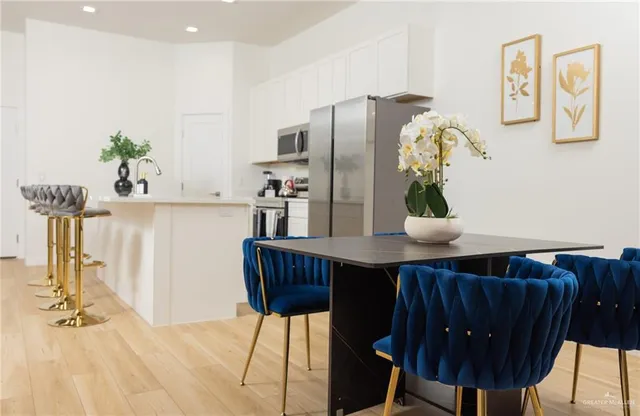 a bedroom with a bed and a potted plant