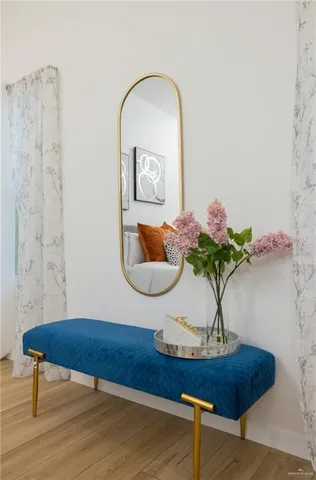 a kitchen with a sink cabinets and wooden floor