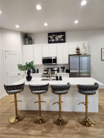 a kitchen with a table and chairs