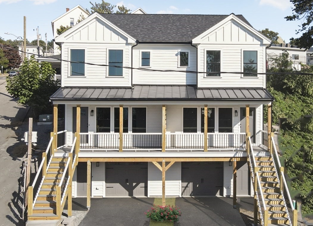 337 Danforth Street, Unit 7 Fall River, MA 02720 - Photo 2 of 28 a front view of a house with a porch