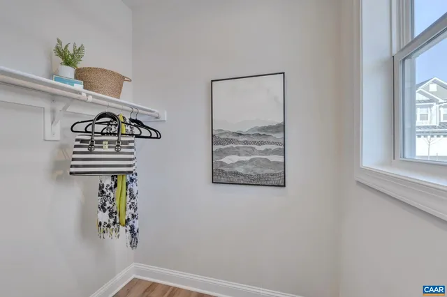 a view of front door with wooden floor