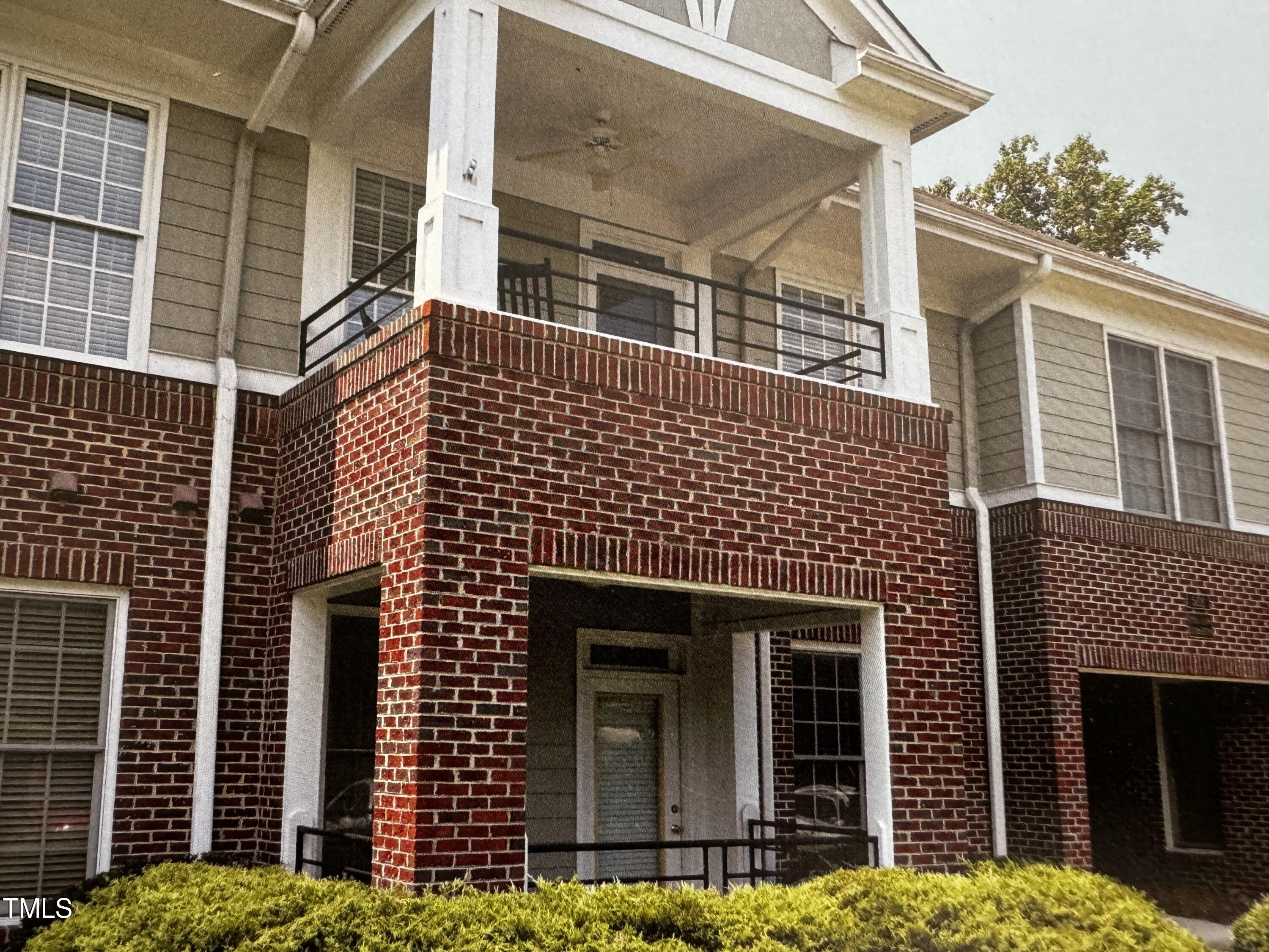 522 Aberdeen Drive, Unit 106 Chapel Hill, NC 27516 - Photo 1 of 68 a front view of a house with a garden