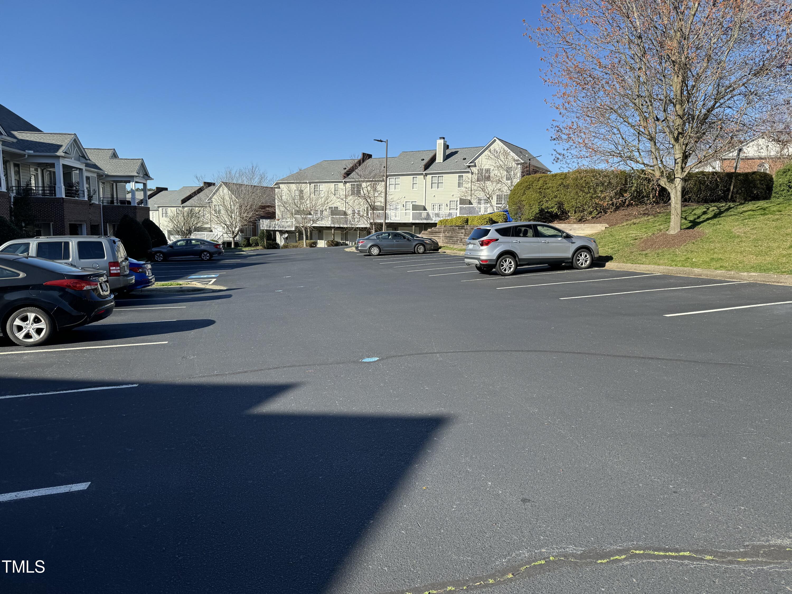 522 Aberdeen Drive, Unit 106 Chapel Hill, NC 27516 - Photo 44 of 68 a car parked on the side of a street