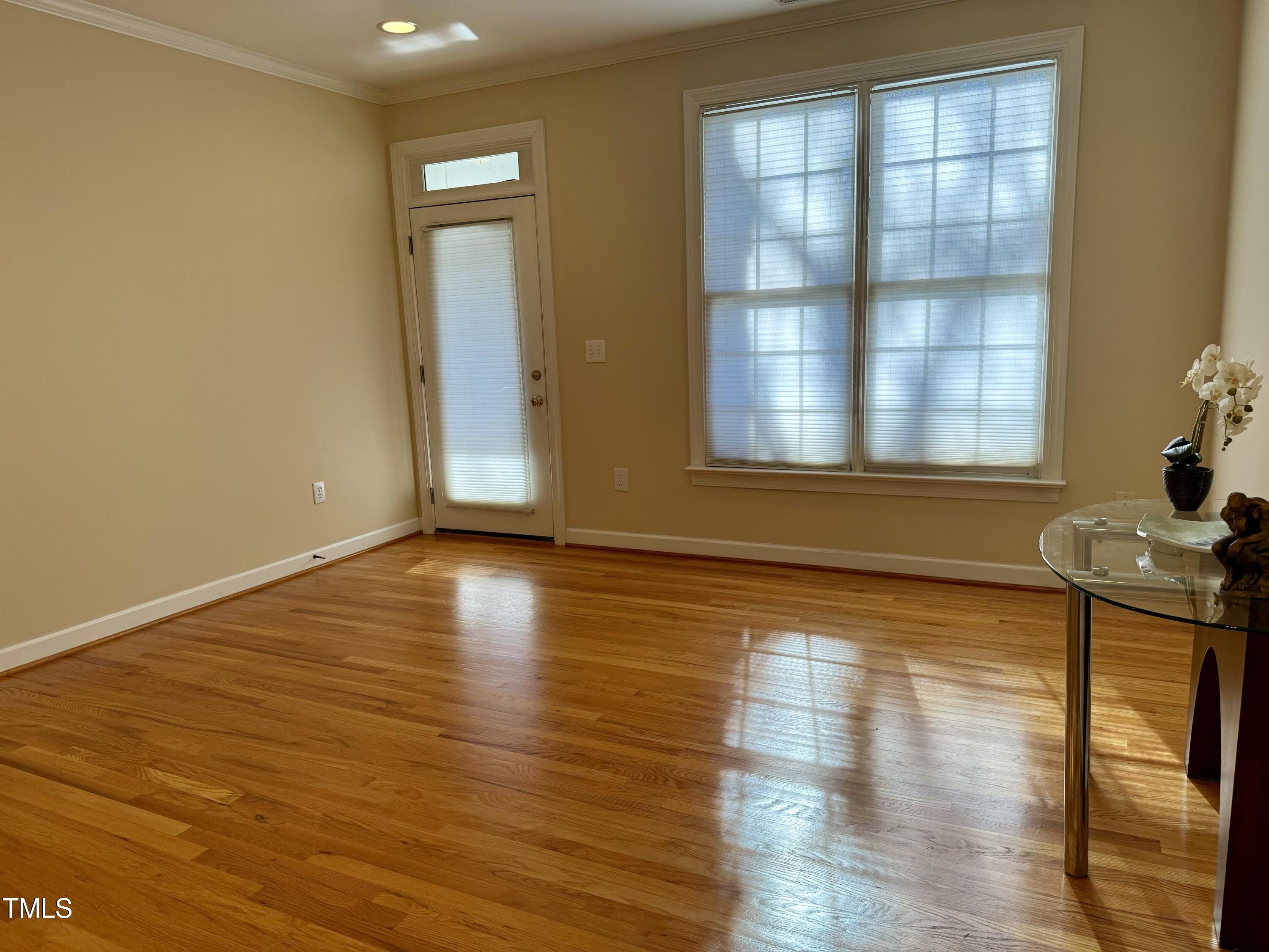 522 Aberdeen Drive, Unit 106 Chapel Hill, NC 27516 - Photo 53 of 68 a view of empty room with wooden floor and fan