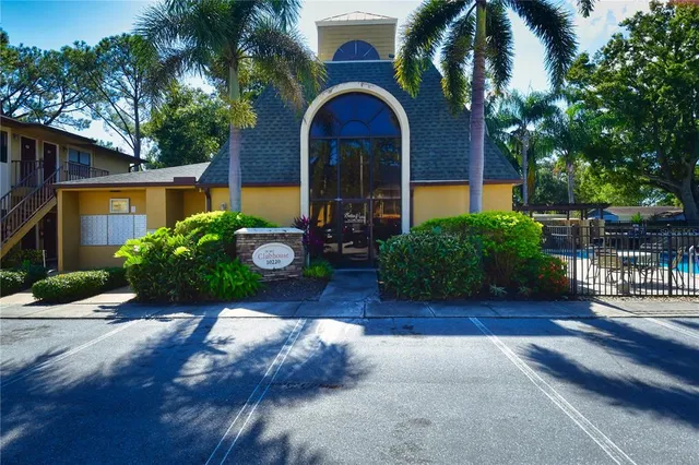 a swimming pool with outdoor seating and yard