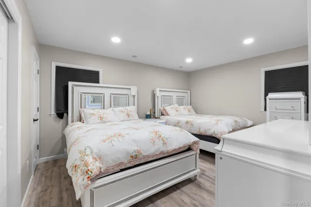 a bedroom with a bed and a television