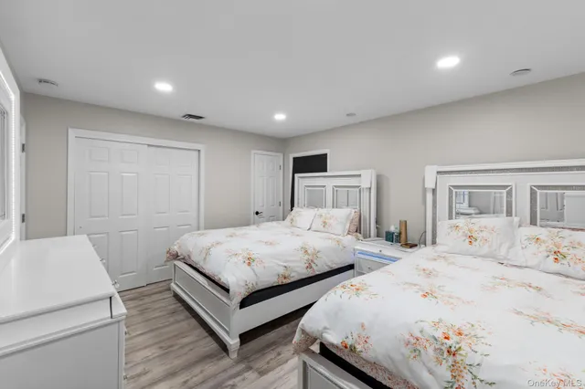 a bedroom with double bed and a window