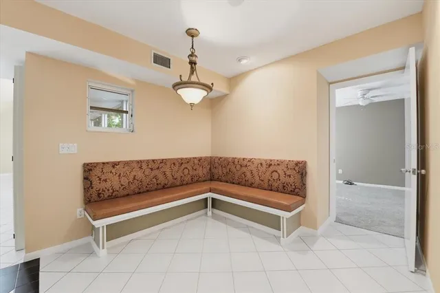 a kitchen with stainless steel appliances granite countertop a sink and a refrigerator