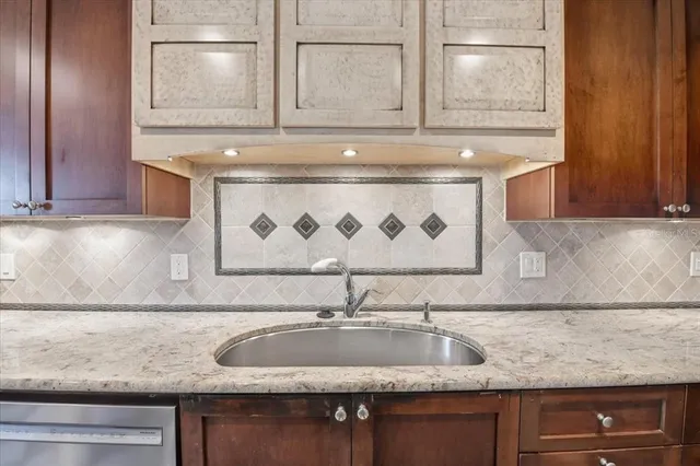 a room with a black white checkered floor with a black white checkered floor and a bathroom with a sink