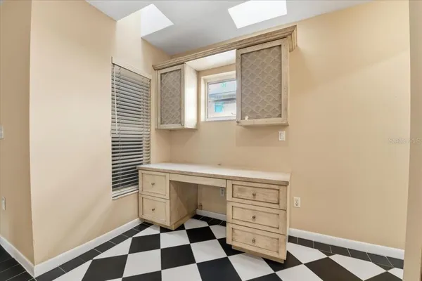 a view of an empty room with a window