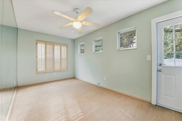 a view of living room and kitchen with wooden floor
