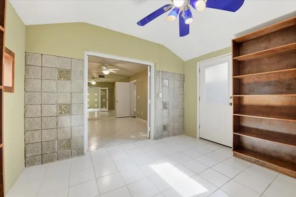 a view of an empty room with a window