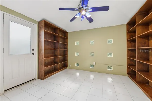 a view of an empty room with a bathroom