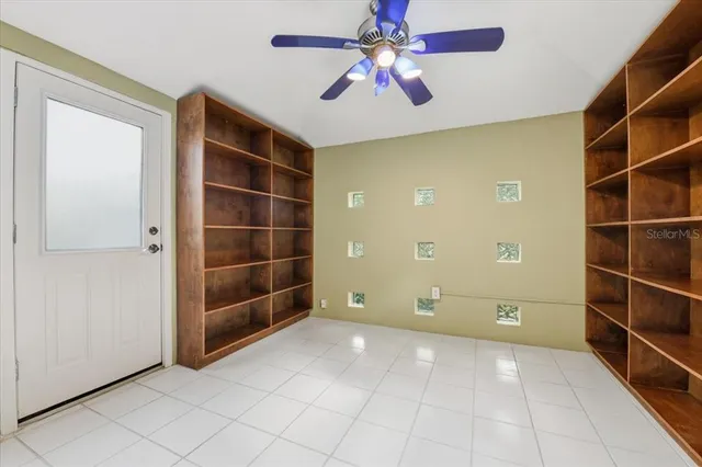 a view of an empty room with a bathroom