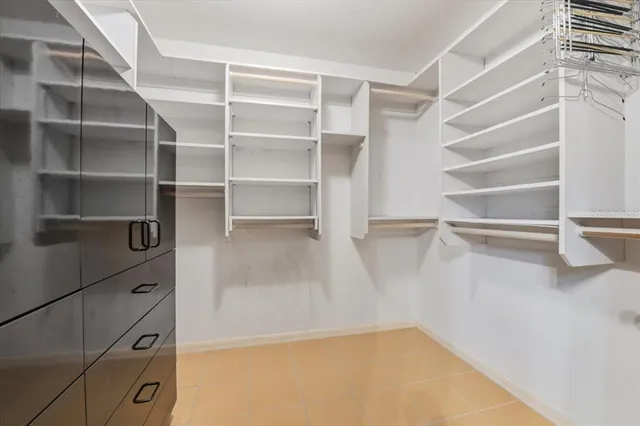 a view of a livingroom with furniture and a ceiling fan