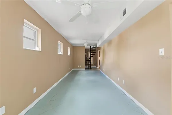 a view of empty room with a bathroom