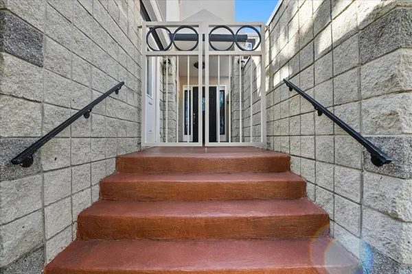 a view of a bathroom with a sink and a mirror