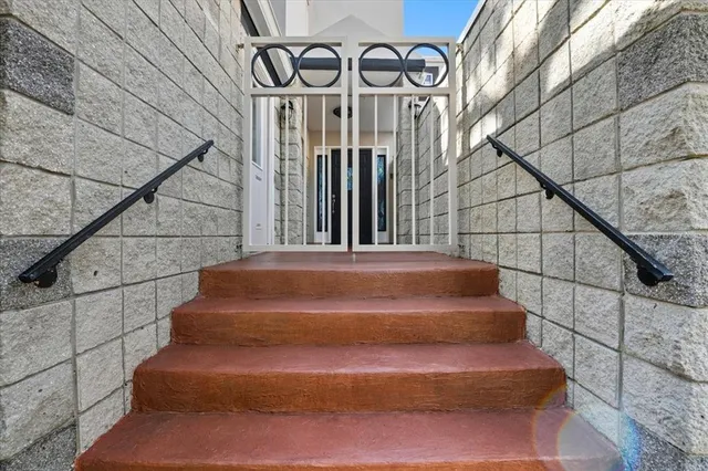 a view of a bathroom with a sink and a mirror