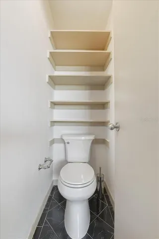 a view of a pathway of a building with wooden fence