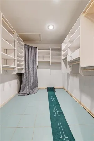 a view of a pathway of a house with wooden floor