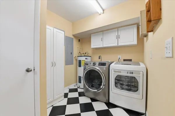 a garden with a bench and some trees