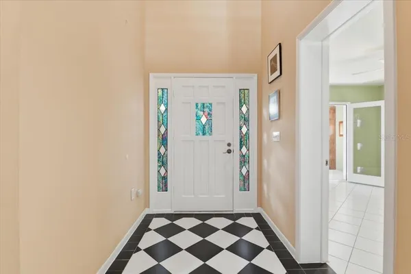 a view of a livingroom with furniture and a ceiling fan
