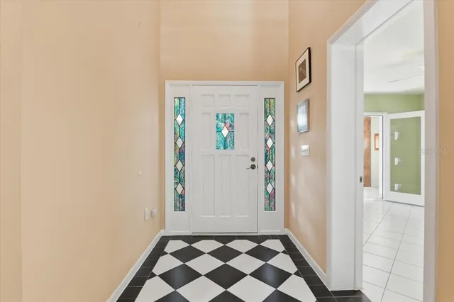 a view of a livingroom with furniture and a ceiling fan