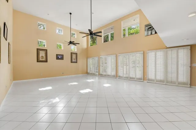 a view of a livingroom with furniture and floor to ceiling window