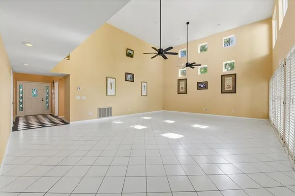 a bathroom with a black and white checkered floor