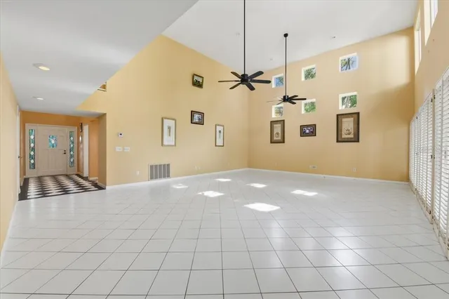 a bathroom with a black and white checkered floor