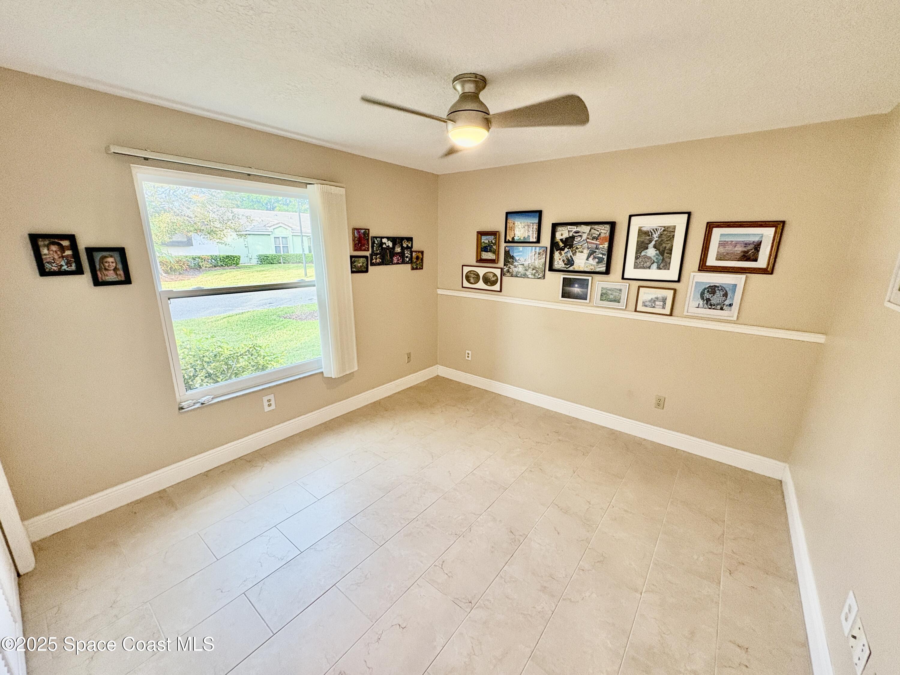 349 Country Walk Street Melbourne, FL 32940 - Photo 12 of 20 a view of a big room with windows and cabinet