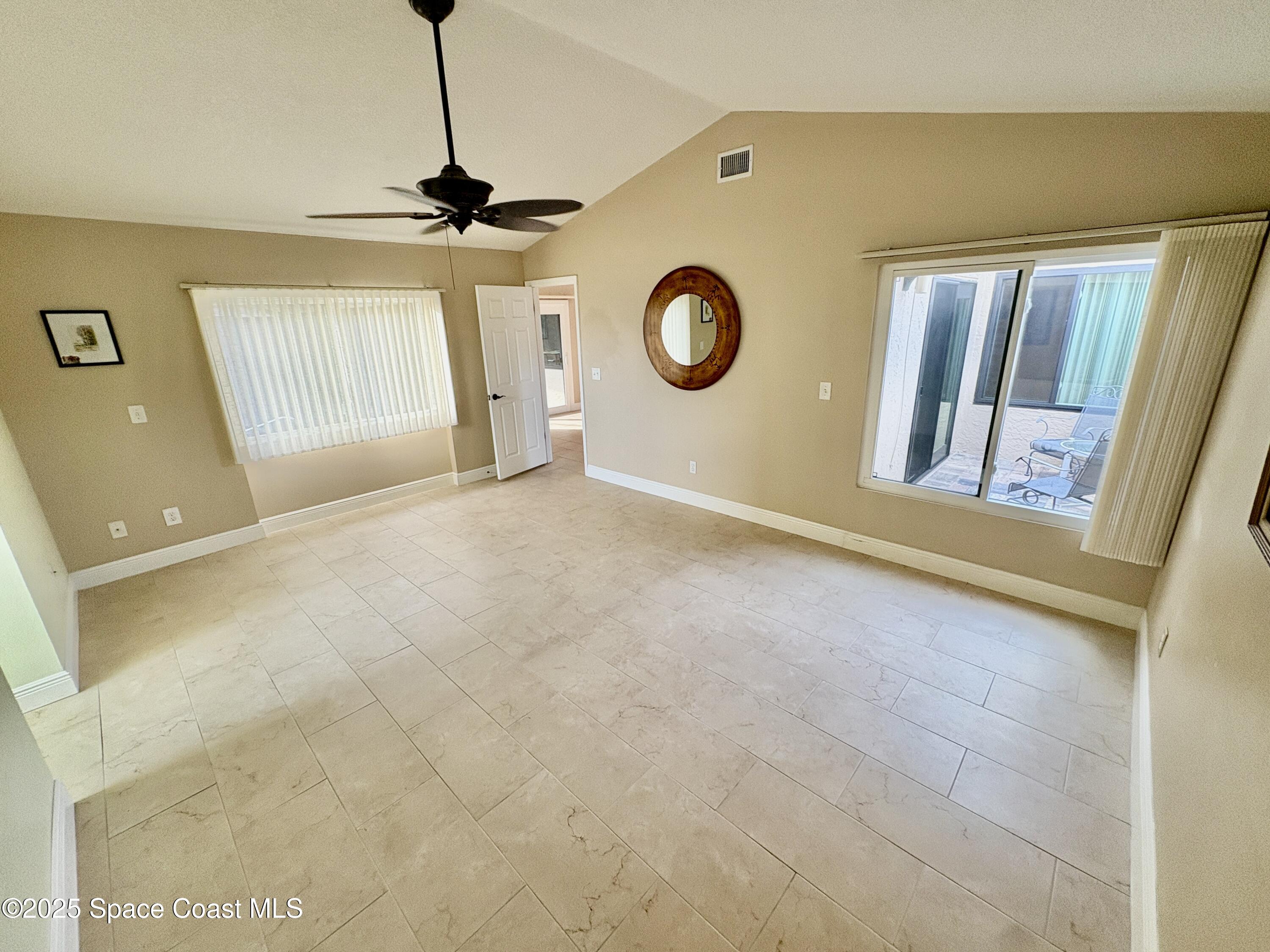 349 Country Walk Street Melbourne, FL 32940 - Photo 8 of 20 a view of a livingroom with a dishwasher and furniture
