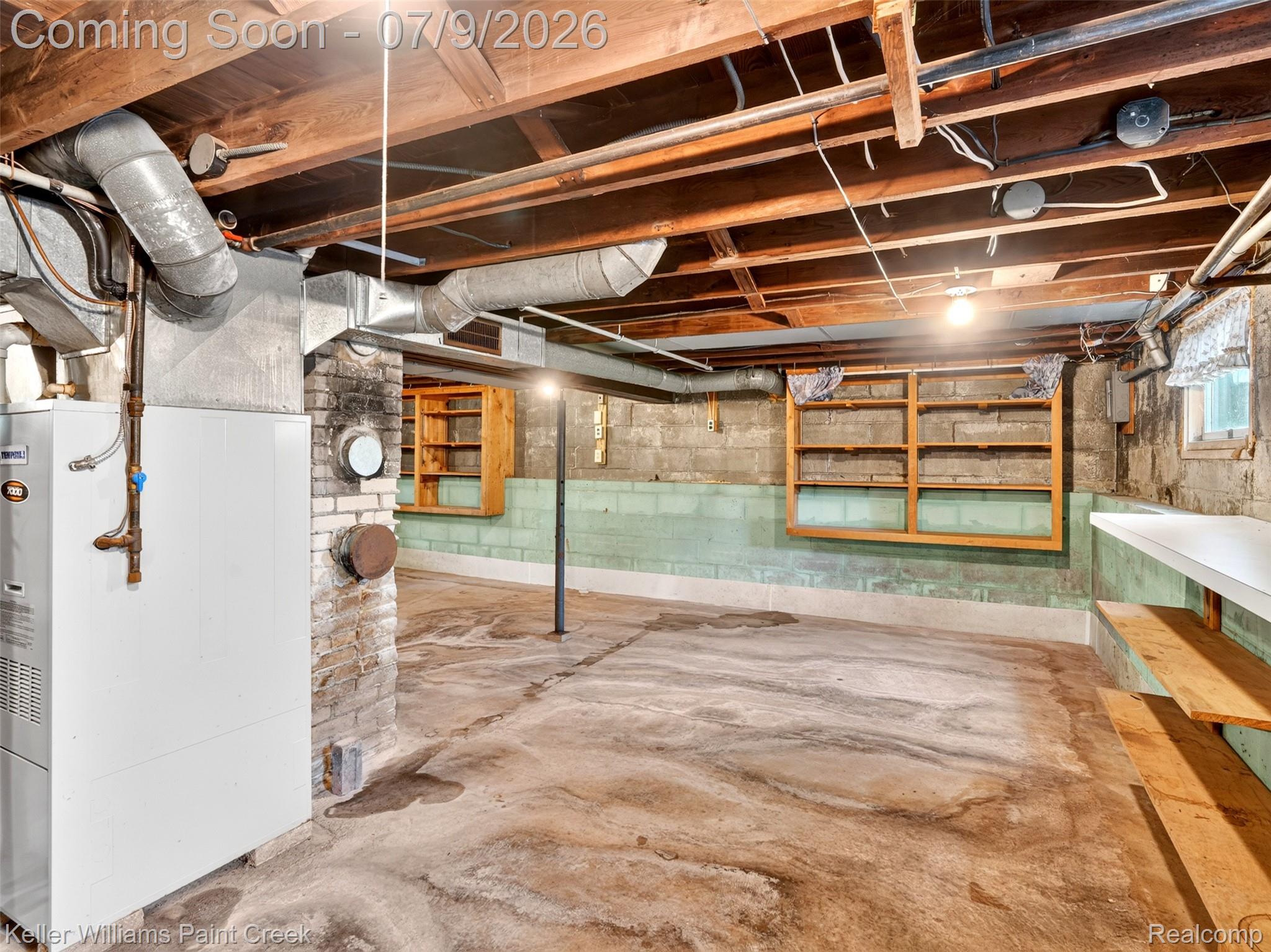 204 Russell Road Kawkawlin, MI 48631 - Photo 46 of 82 Unfinished basement with exposed ceiling joists and concrete flooring