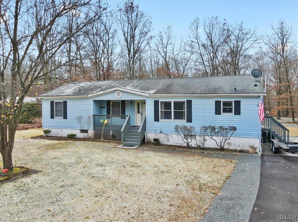173 Shenkel Road Effort, PA 18330 - Photo 7 of 46 front view of a house with a patio