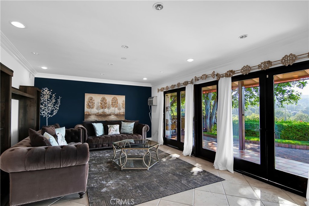 3701 Royal Meadow Road Sherman Oaks, CA 91403 - Photo 24 of 43 a living room with furniture a rug and a large window