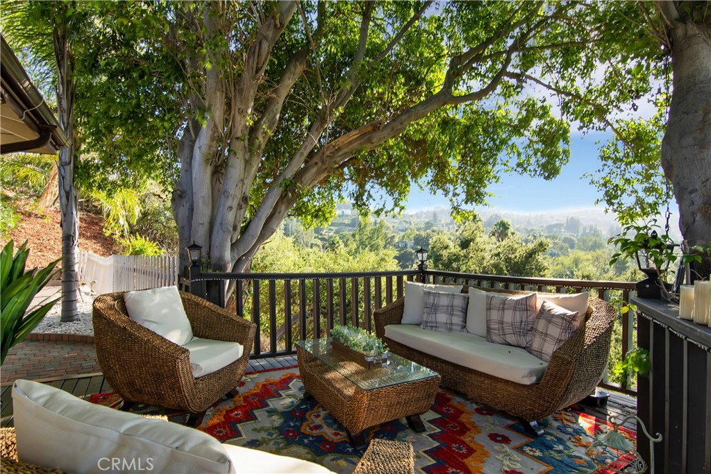 3701 Royal Meadow Road Sherman Oaks, CA 91403 - Photo 25 of 43 a roof deck with couches and a large tree