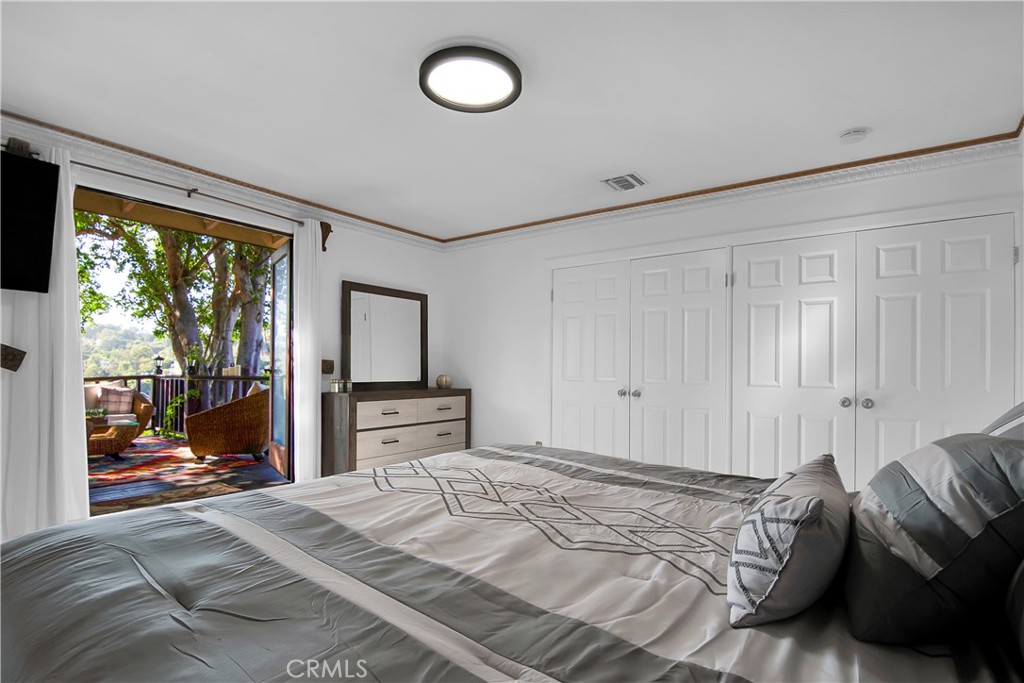 3701 Royal Meadow Road Sherman Oaks, CA 91403 - Photo 32 of 43 a bedroom with a bed and a large window