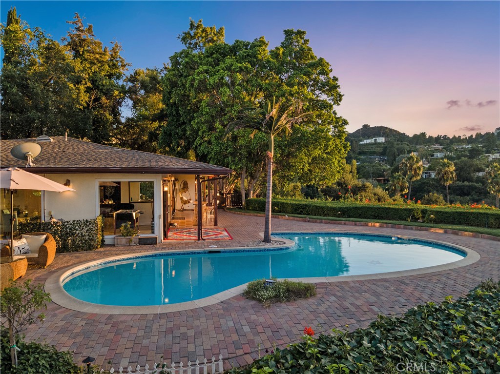 3701 Royal Meadow Road Sherman Oaks, CA 91403 - Photo 39 of 43 a view of a swimming pool with a patio