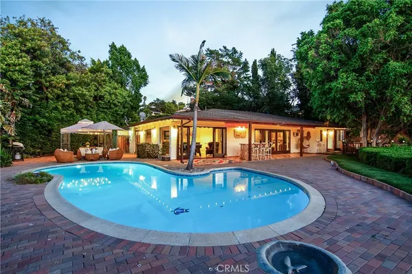 a view of a swimming pool with a patio