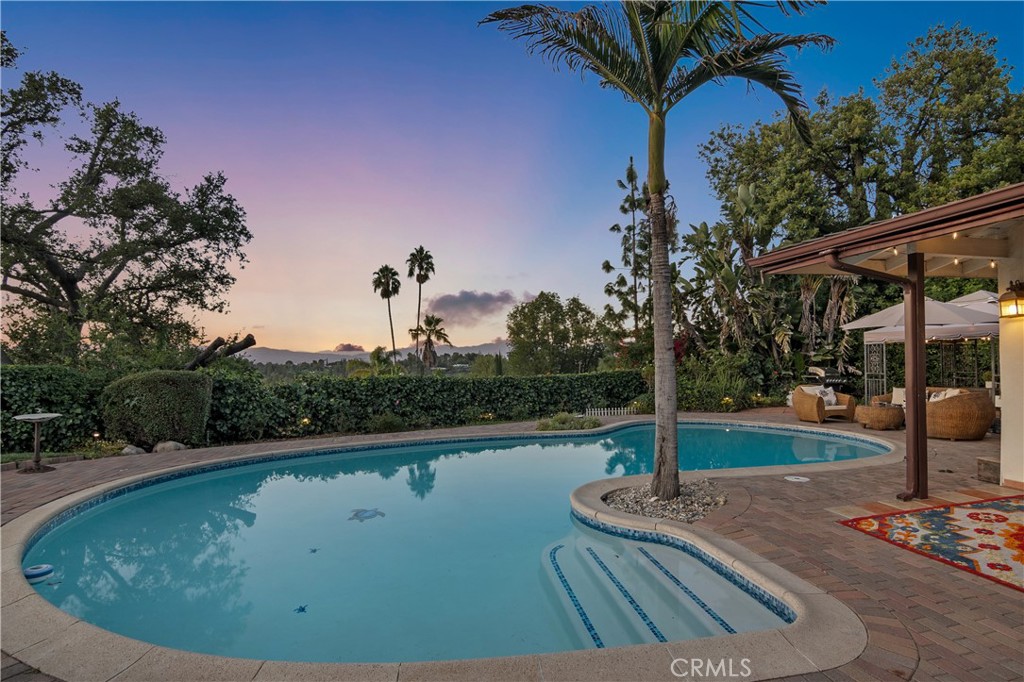 3701 Royal Meadow Road Sherman Oaks, CA 91403 - Photo 42 of 43 a view of a swimming pool with a patio
