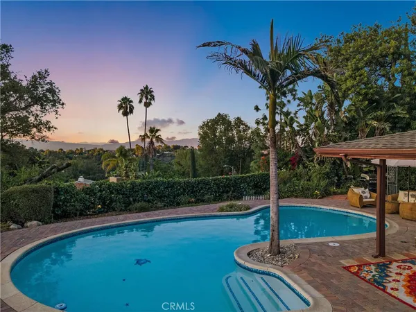 a view of a swimming pool with a patio