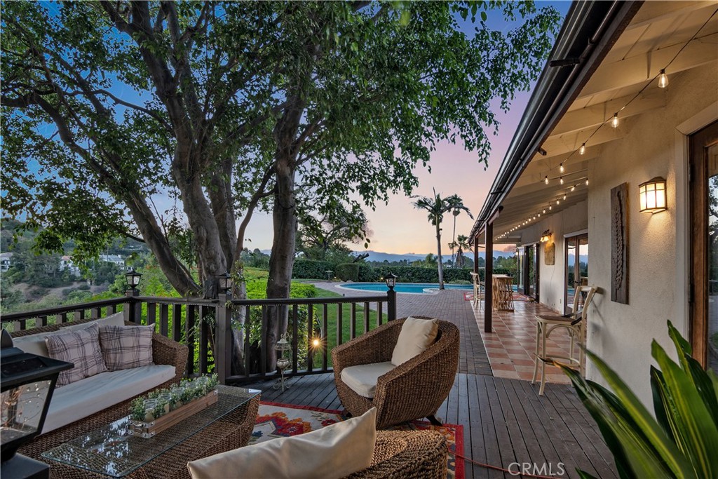3701 Royal Meadow Road Sherman Oaks, CA 91403 - Photo 10 of 15 a view of a patio with couches table and chairs and wooden floor