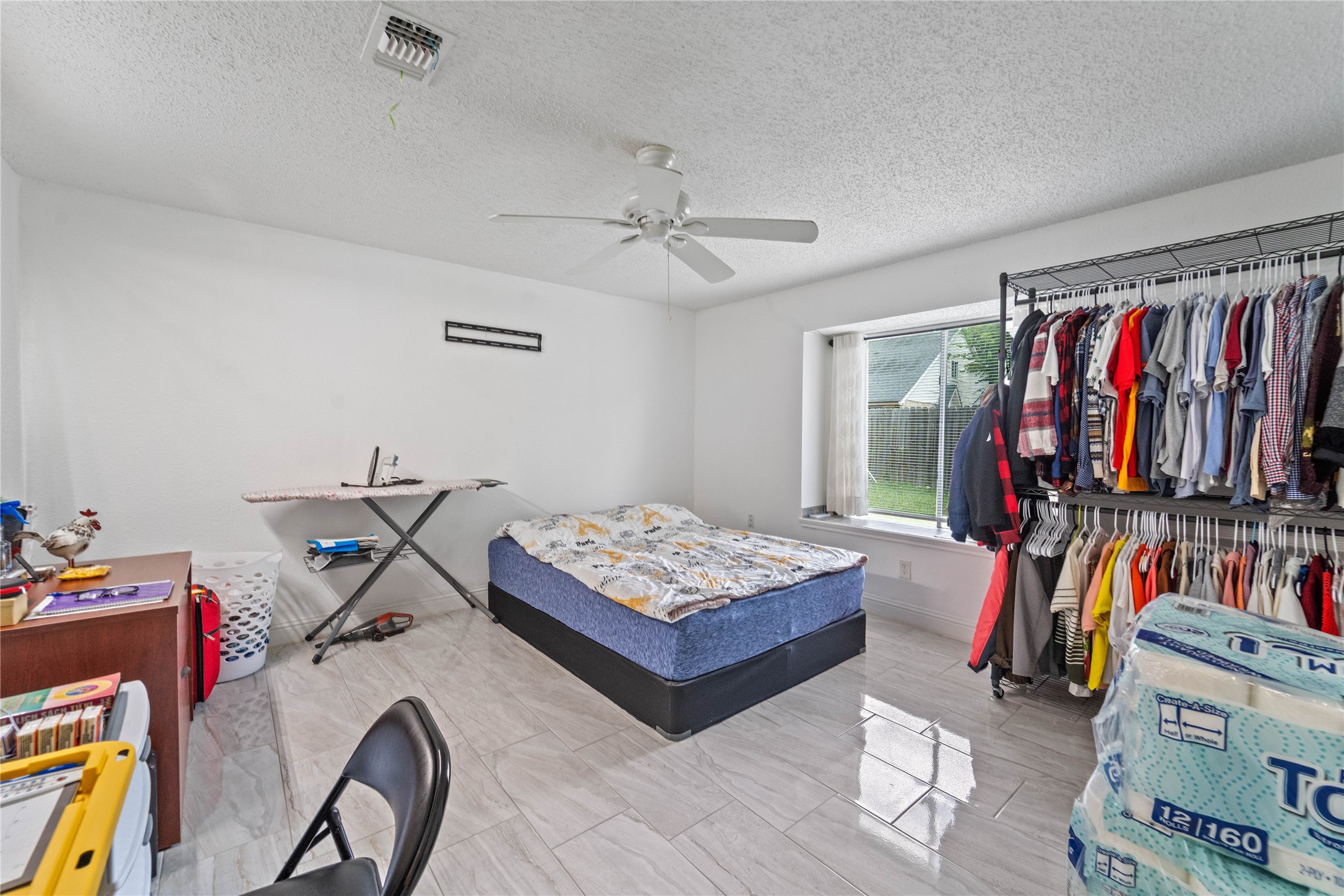 6331 Modesto Drive Houston, TX 77083 - Photo 15 of 31 a living room with lots of furniture and gym equipment