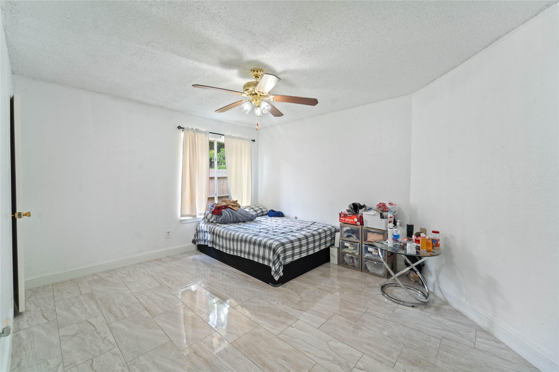 6331 Modesto Drive Houston, TX 77083 - Photo 17 of 31 a living room with furniture and a chandelier