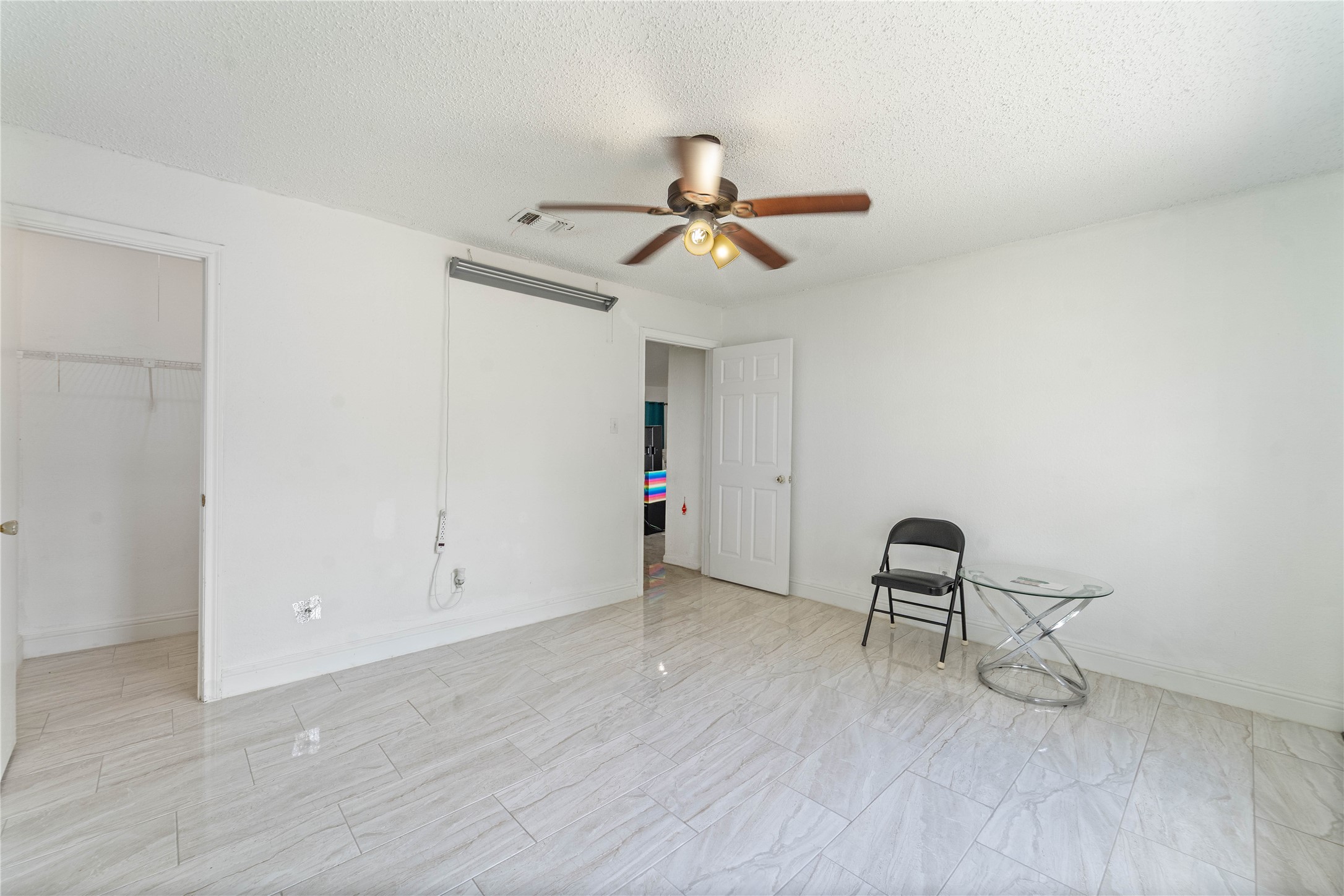 6331 Modesto Drive Houston, TX 77083 - Photo 21 of 31 a view of workspace with wooden floor and ceiling fan