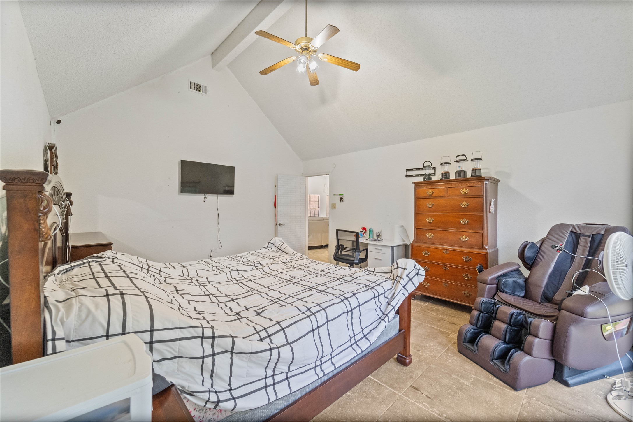 6331 Modesto Drive Houston, TX 77083 - Photo 24 of 31 a bedroom with a bed a couch and a chandelier