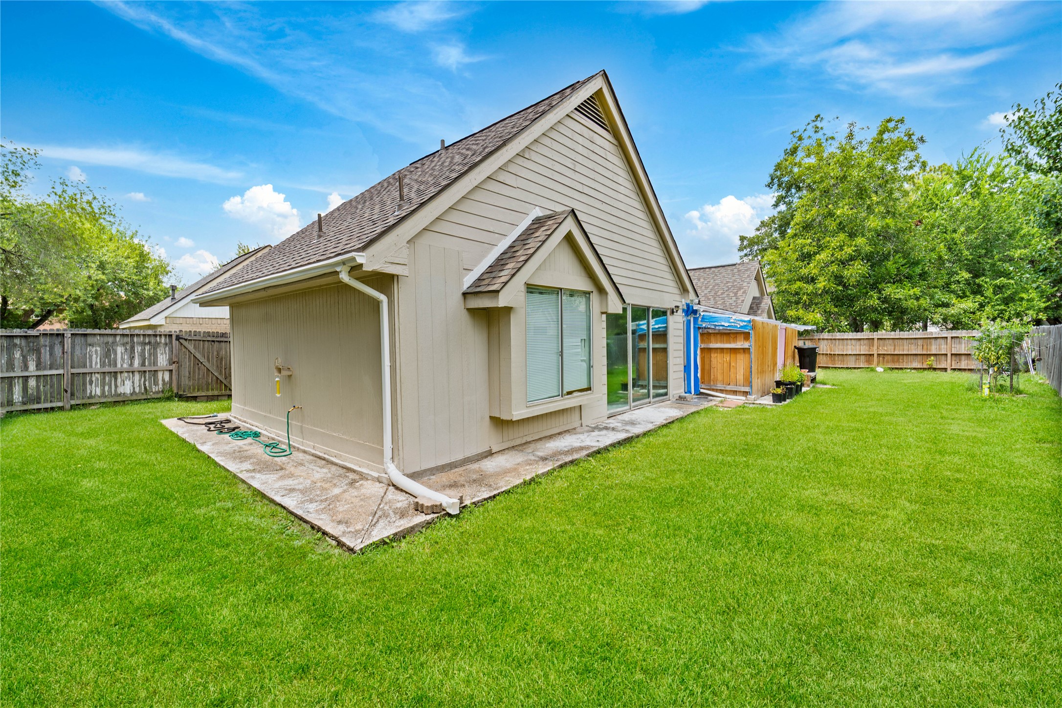 6331 Modesto Drive Houston, TX 77083 - Photo 30 of 31 a front view of house with a garden