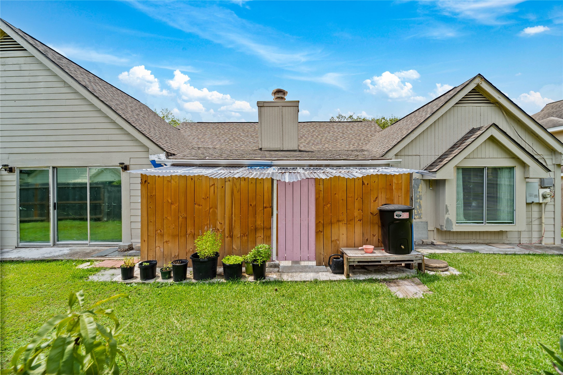 6331 Modesto Drive Houston, TX 77083 - Photo 31 of 31 a view of an house with backyard porch and patio