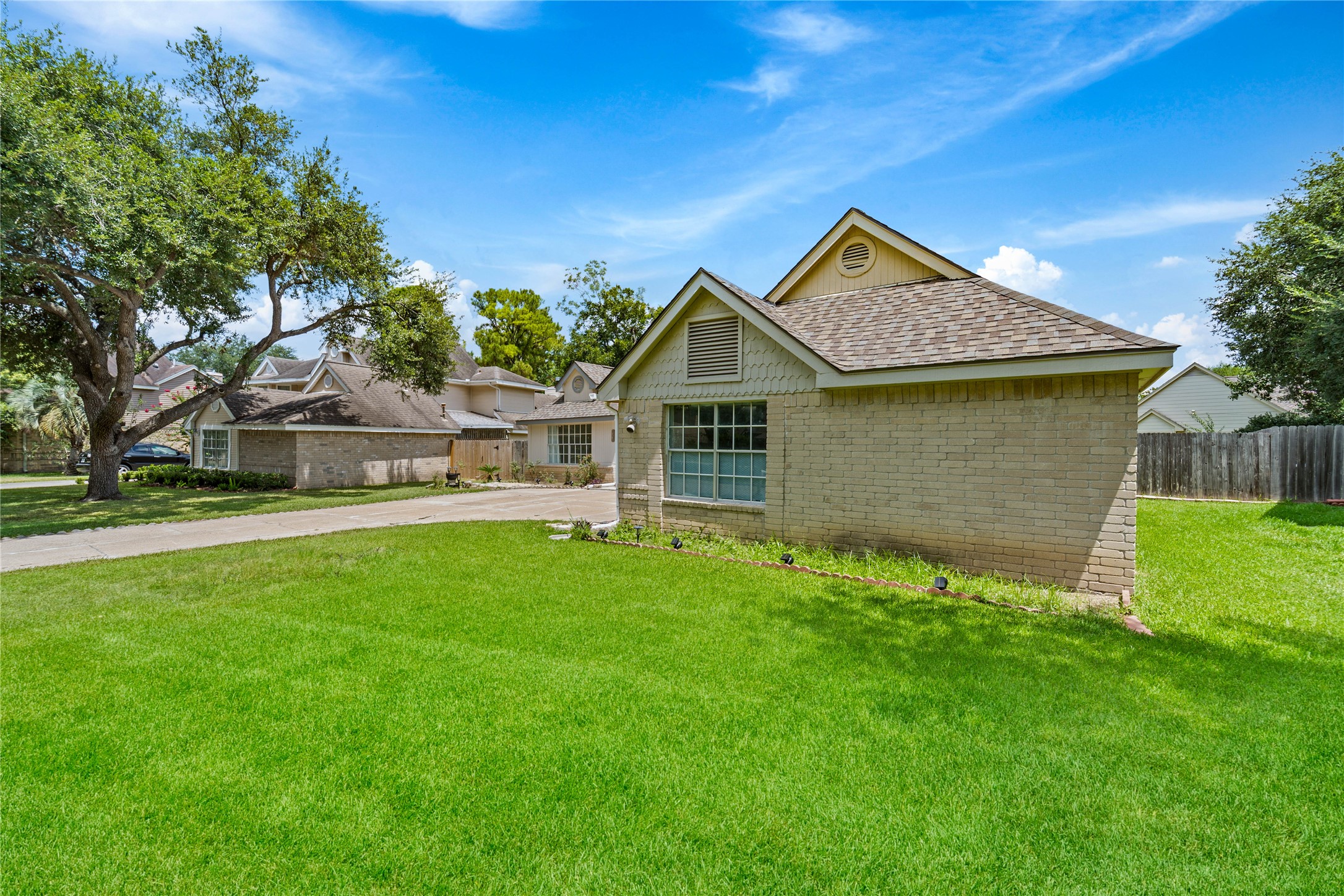 6331 Modesto Drive Houston, TX 77083 - Photo 4 of 31 a front view of a house with garden